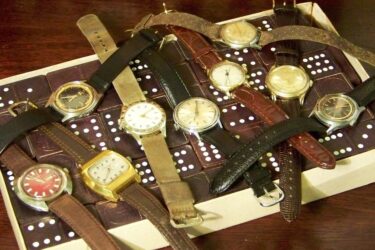 Selection of vintage watches on wooden table