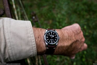 Man wearing watch on left wrist with cream sleeve showing